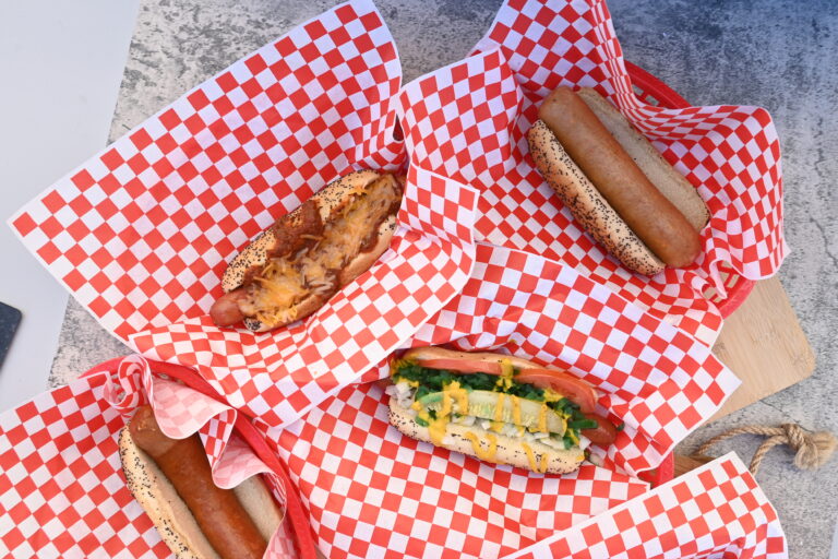 Hot dogs on red and white checkered paper at Under Construction Hot Dogs.