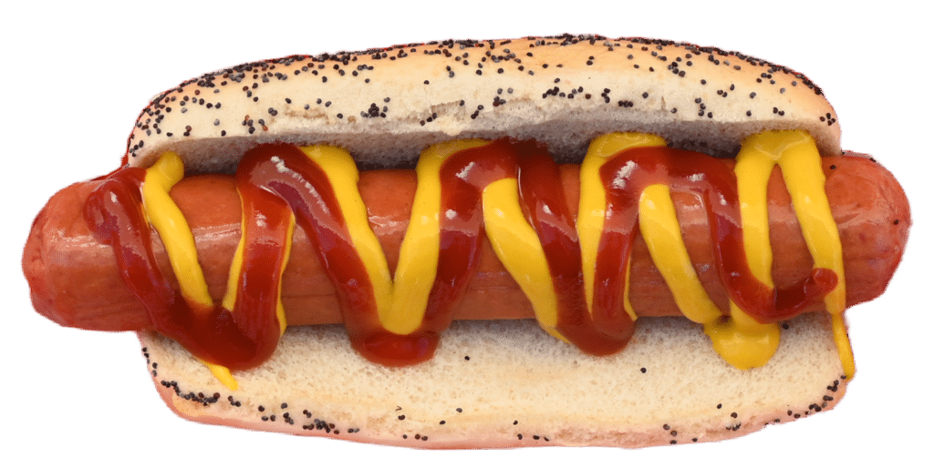 A horizontal photo of a grilled hot dog with ketchup and mustard zigzags in a poppy-seed bun, viewed from above.